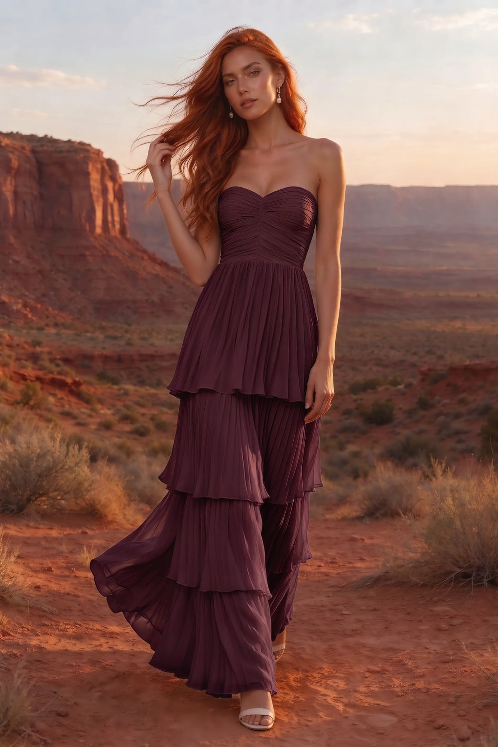 Translation missing: en.Outdoor front view in a desert canyon at sunset of Sonia burgundy tiered pleated maxi dress with a long flowing skirt content.product_image_secondary