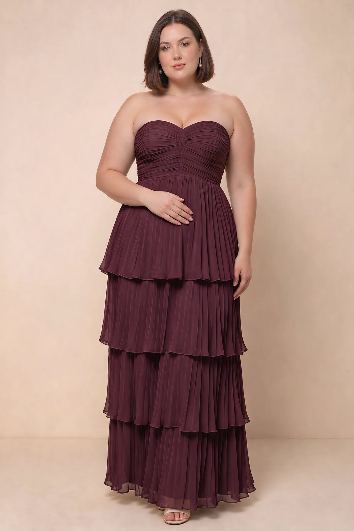 Front view on a second model of Sonia burgundy tiered pleated maxi dress with a long flowing skirt