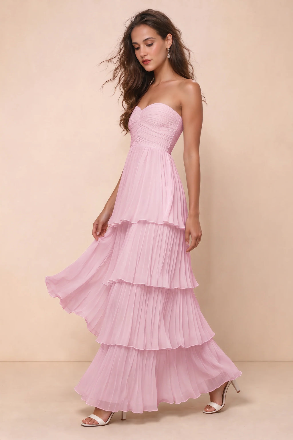 Front studio view of Sonia candy pink tiered pleated maxi dress with a long flowing skirt