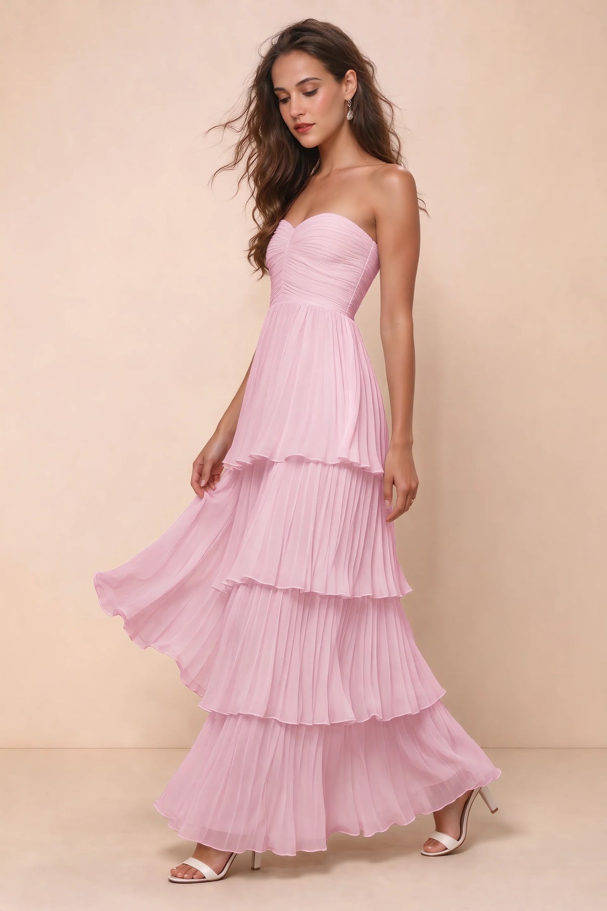 Front studio view of Sonia candy pink tiered pleated maxi dress with a long flowing skirt