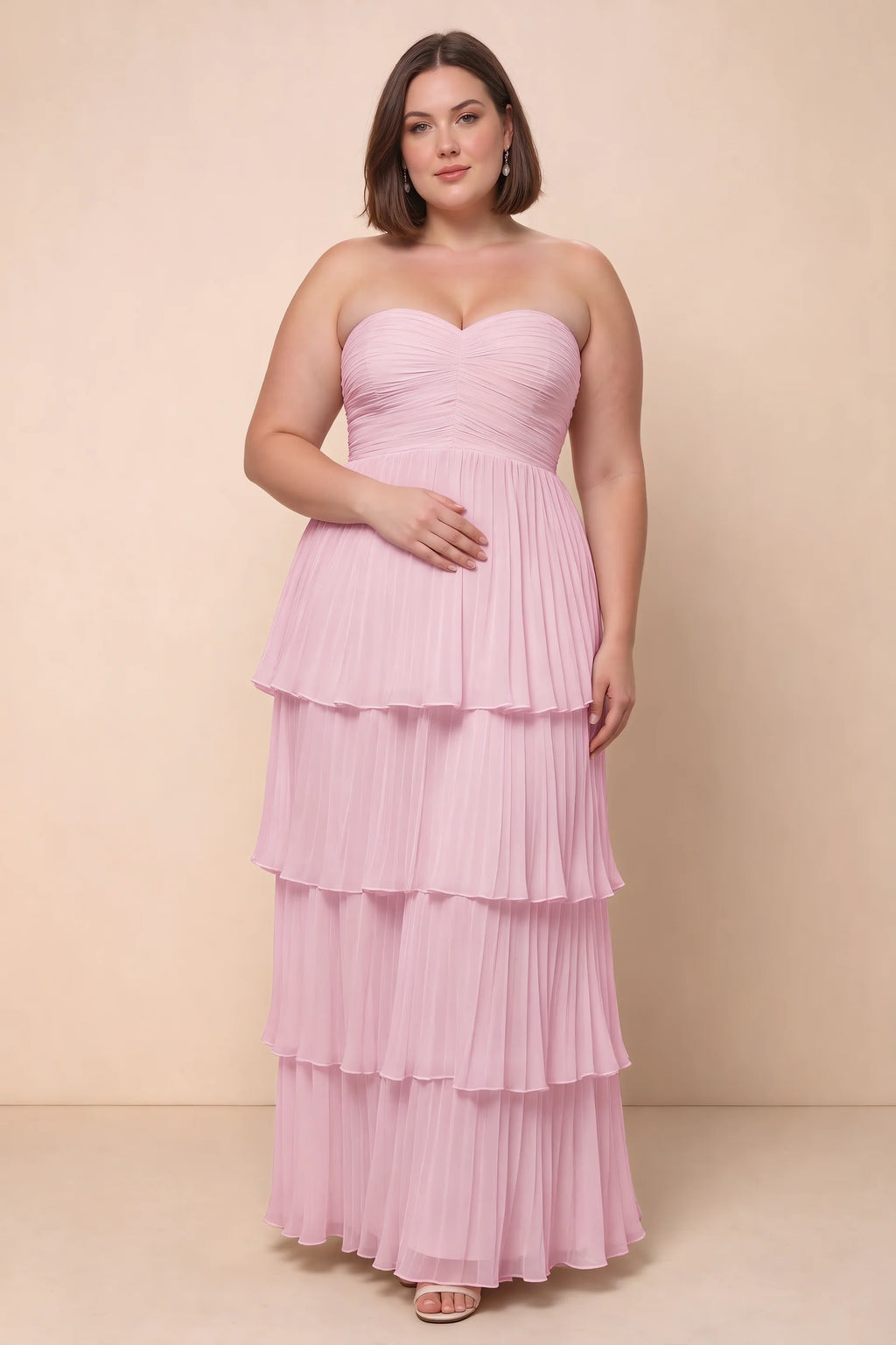 Front view on a second model of Sonia candy pink tiered pleated maxi dress with a long flowing skirt