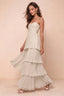 Front studio view of Sonia cream tiered pleated maxi dress with a long flowing skirt