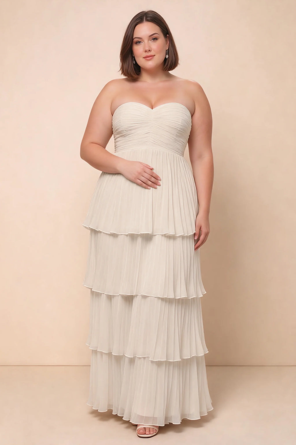 Front view on a second model of Sonia cream tiered pleated maxi dress with a long flowing skirt