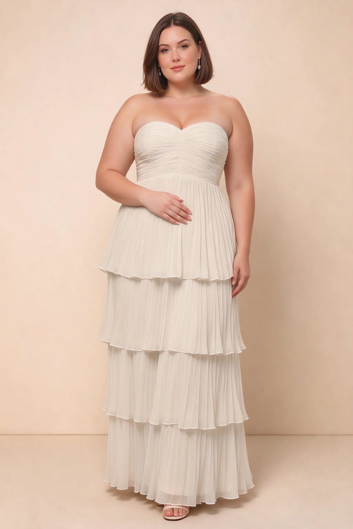 Front view on a second model of Sonia cream tiered pleated maxi dress with a long flowing skirt