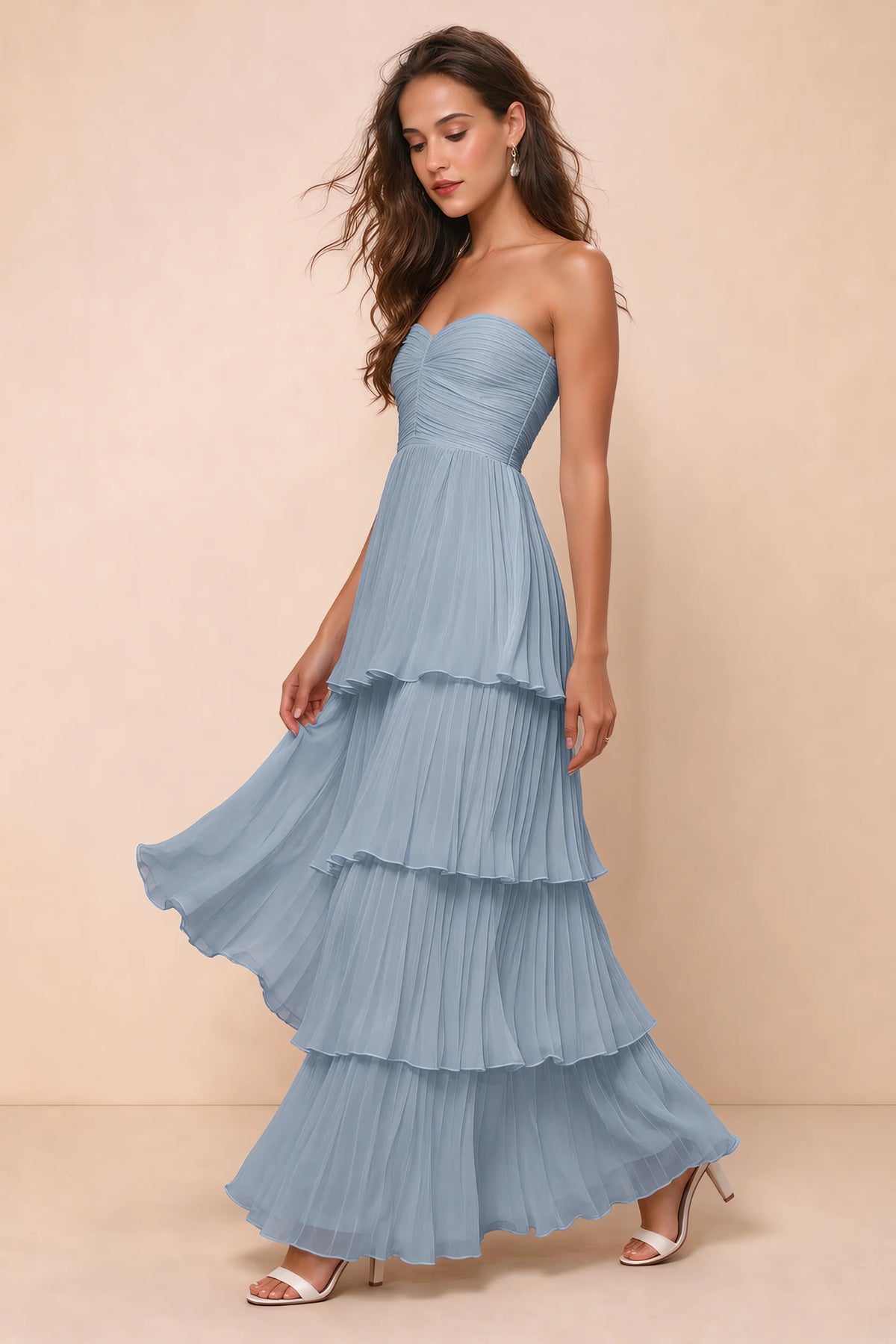 Front studio view of Sonia dusty blue tiered pleated maxi dress with a long flowing skirt