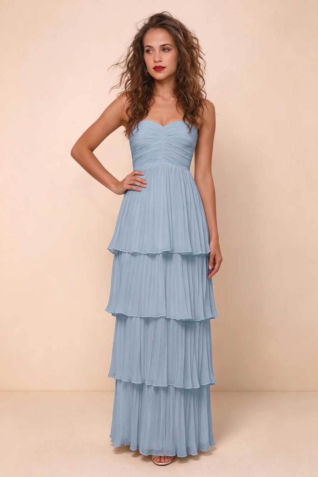 Alternate front studio view of Sonia dusty blue tiered pleated maxi dress with a long flowing skirt