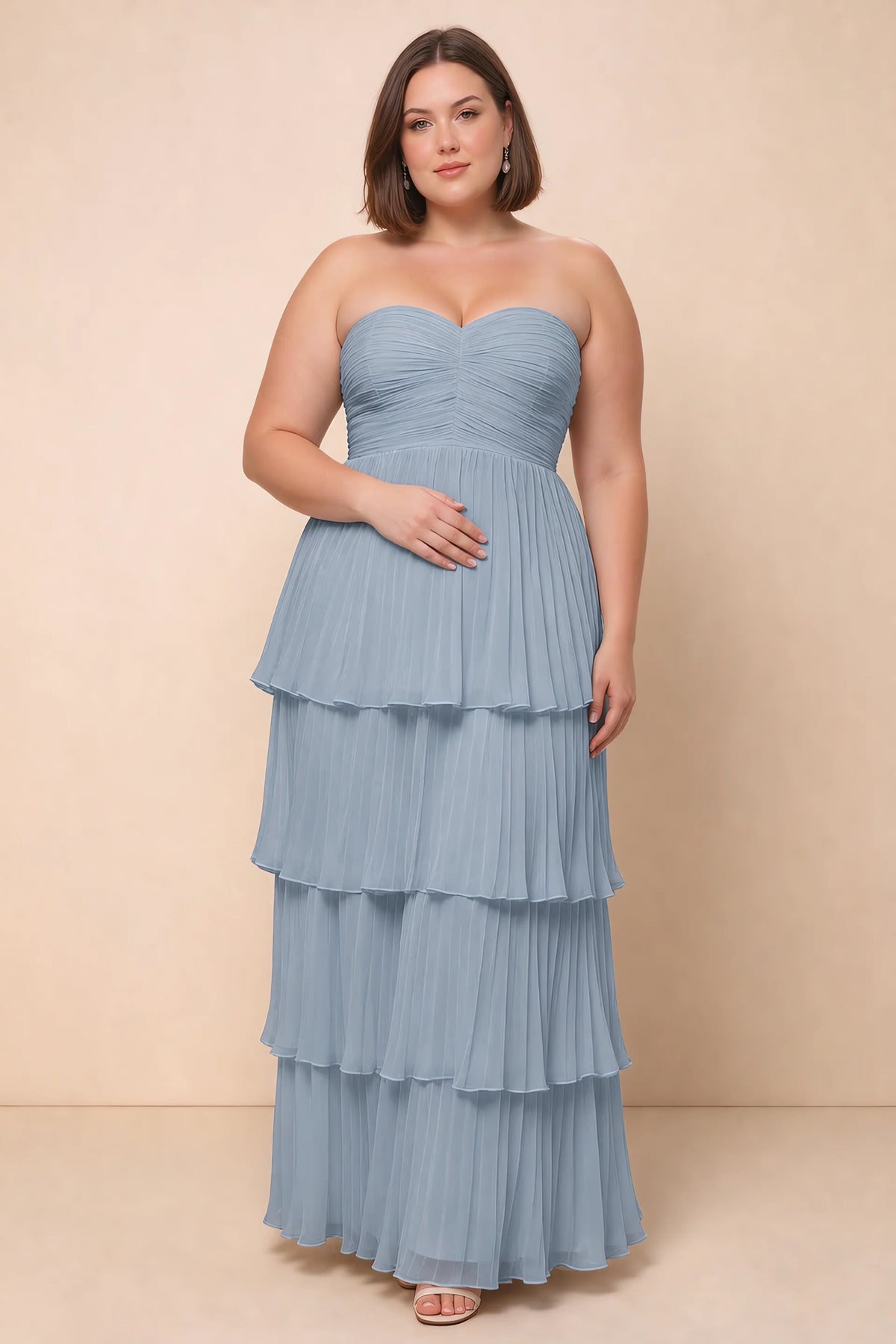 Front view on a second model of Sonia dusty blue tiered pleated maxi dress with a long flowing skirt