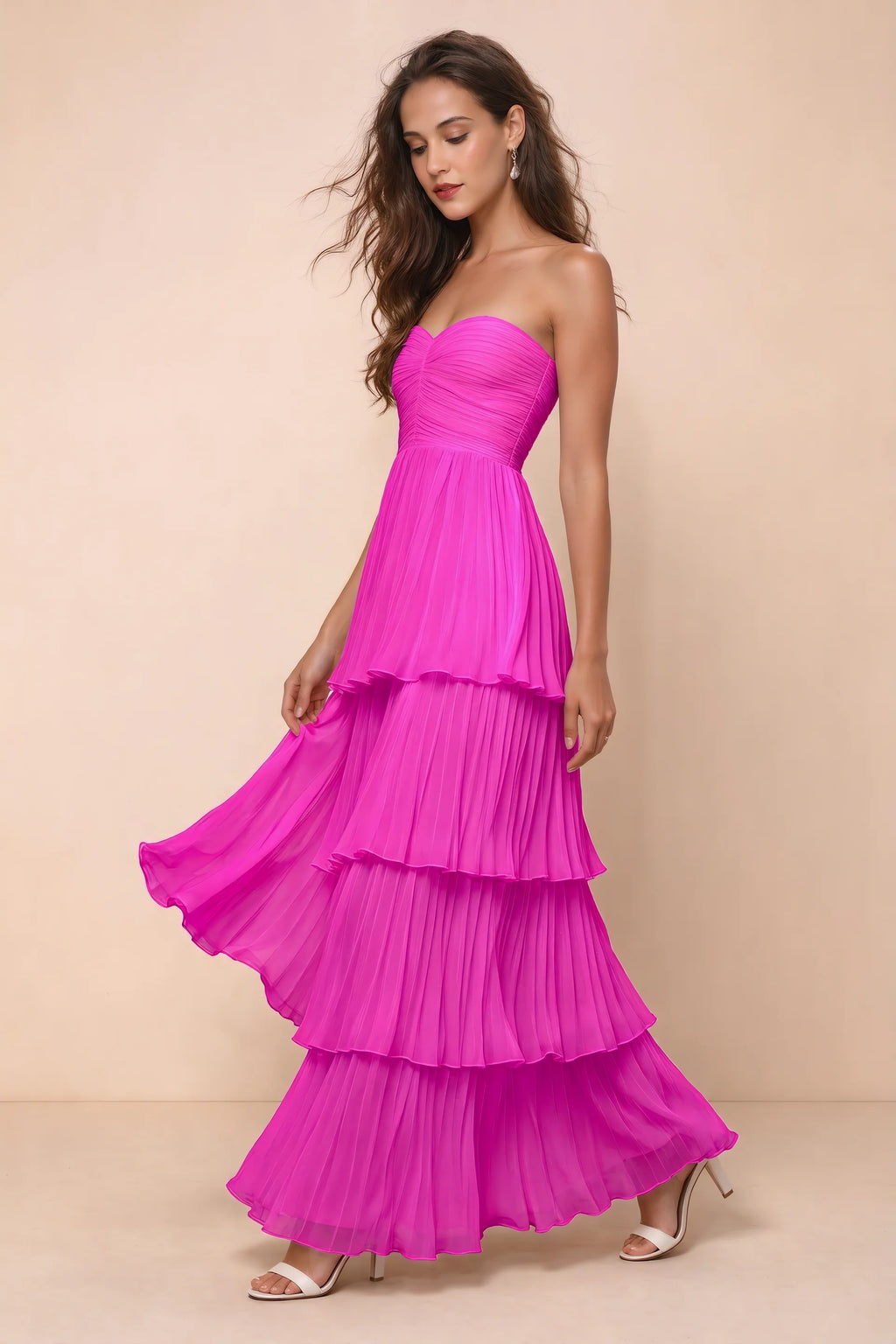 Front studio view of Sonia fuchsia tiered pleated maxi dress with a long flowing skirt