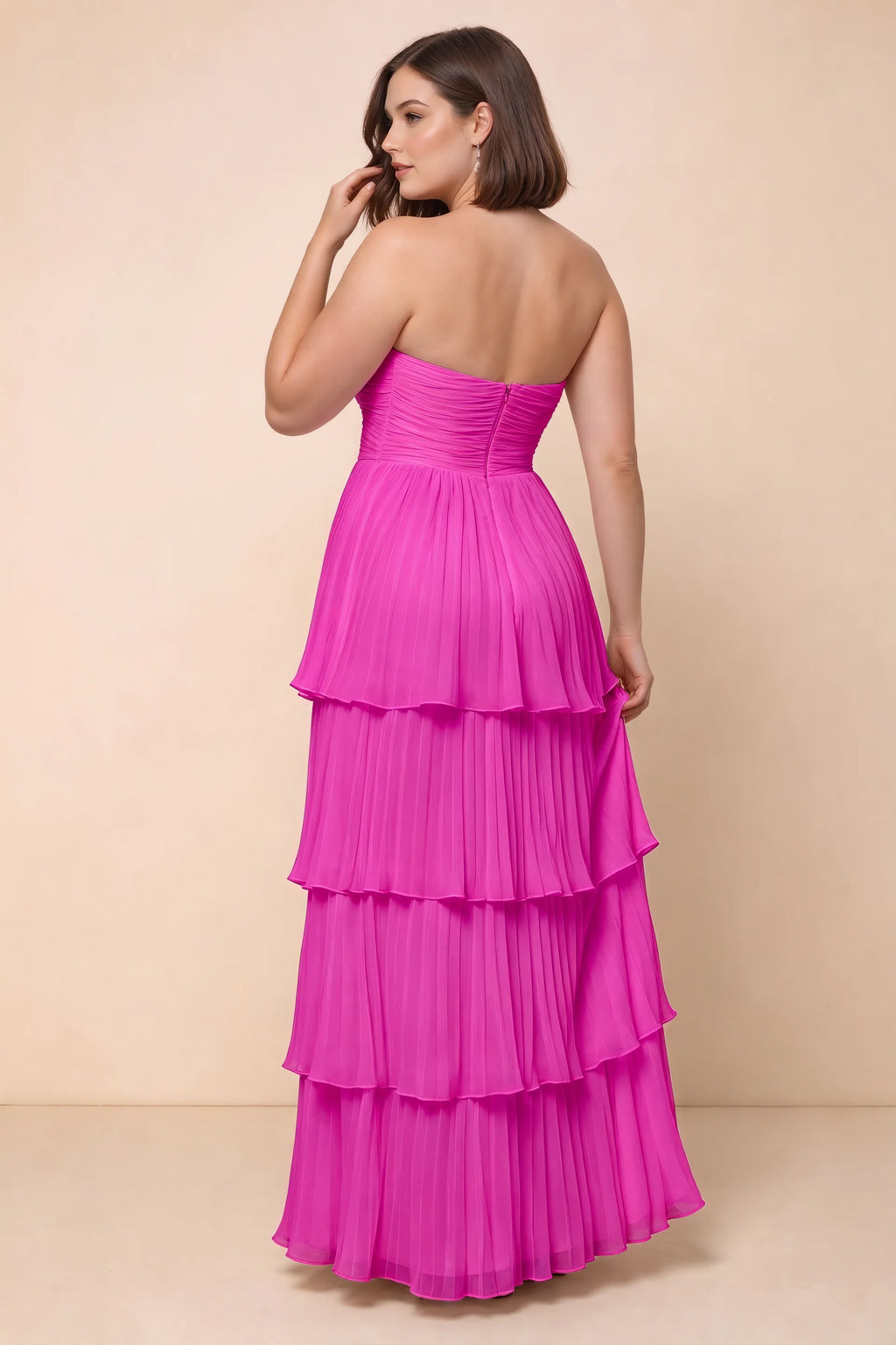 Rear view on a second model of Sonia fuchsia tiered pleated maxi dress with a long flowing skirt