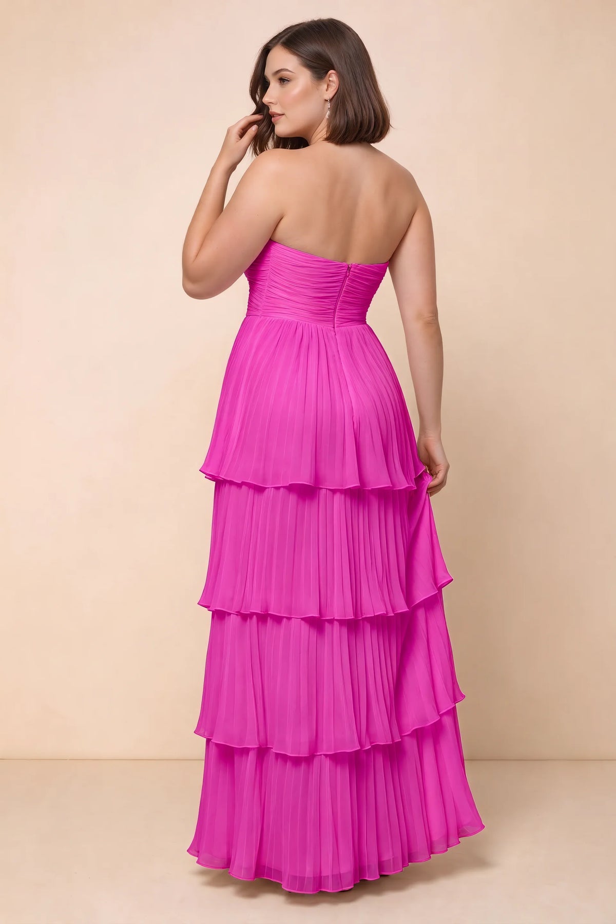 Rear view on a second model of Sonia fuchsia tiered pleated maxi dress with a long flowing skirt