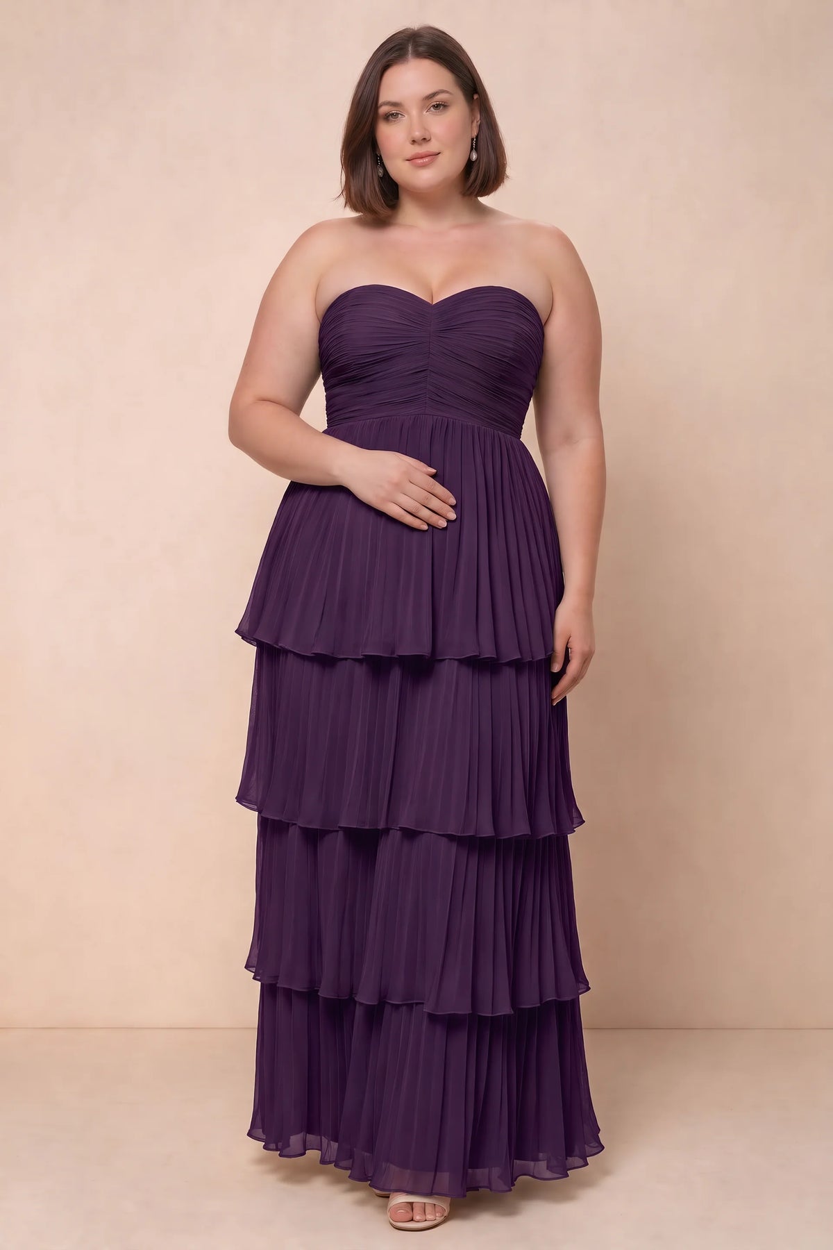 Front view on a second model of Sonia grape tiered pleated maxi dress with a long flowing skirt