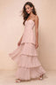 Front studio view of Sonia haze pink tiered pleated maxi dress with a long flowing skirt