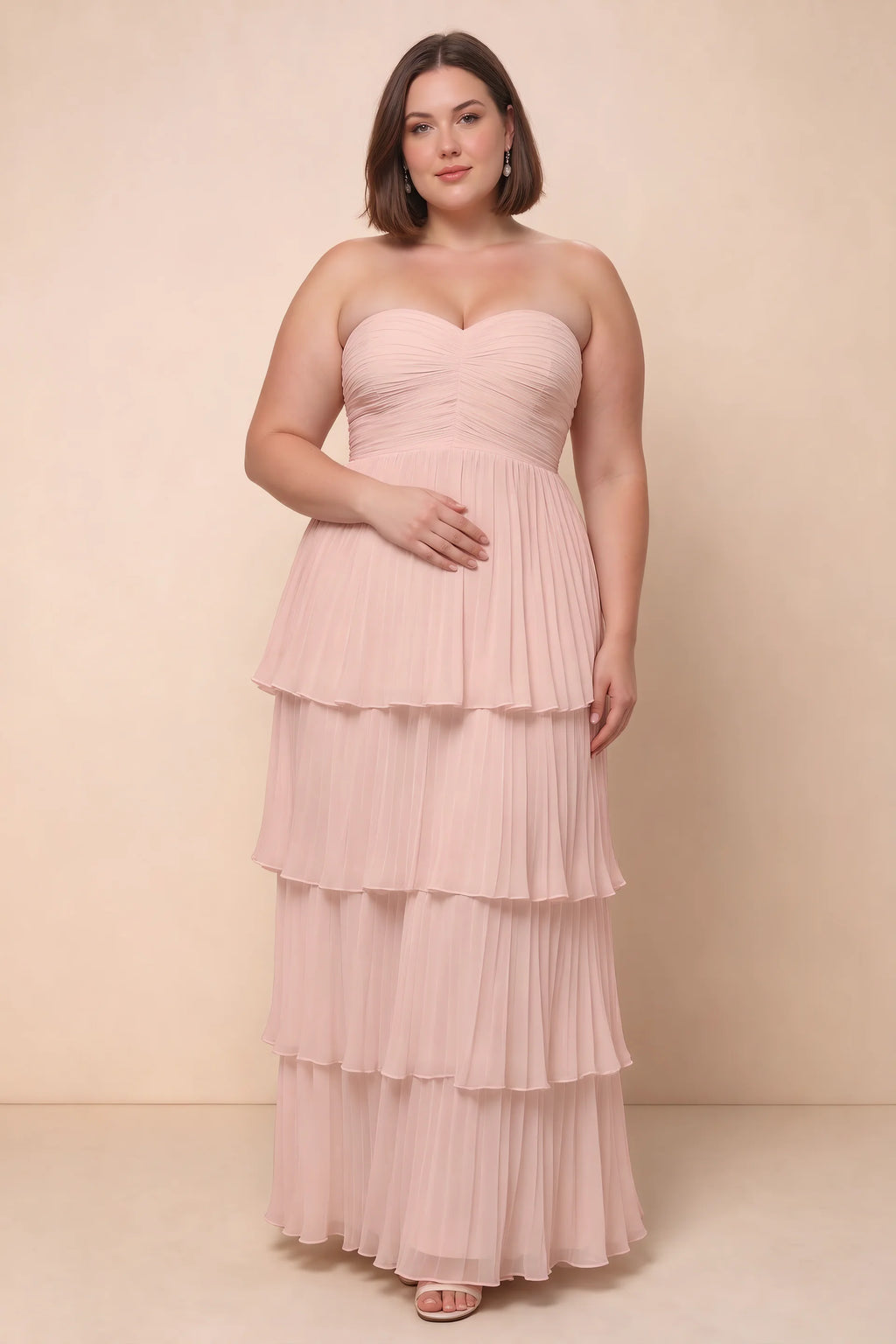 Front view on a second model of Sonia haze pink tiered pleated maxi dress with a long flowing skirt