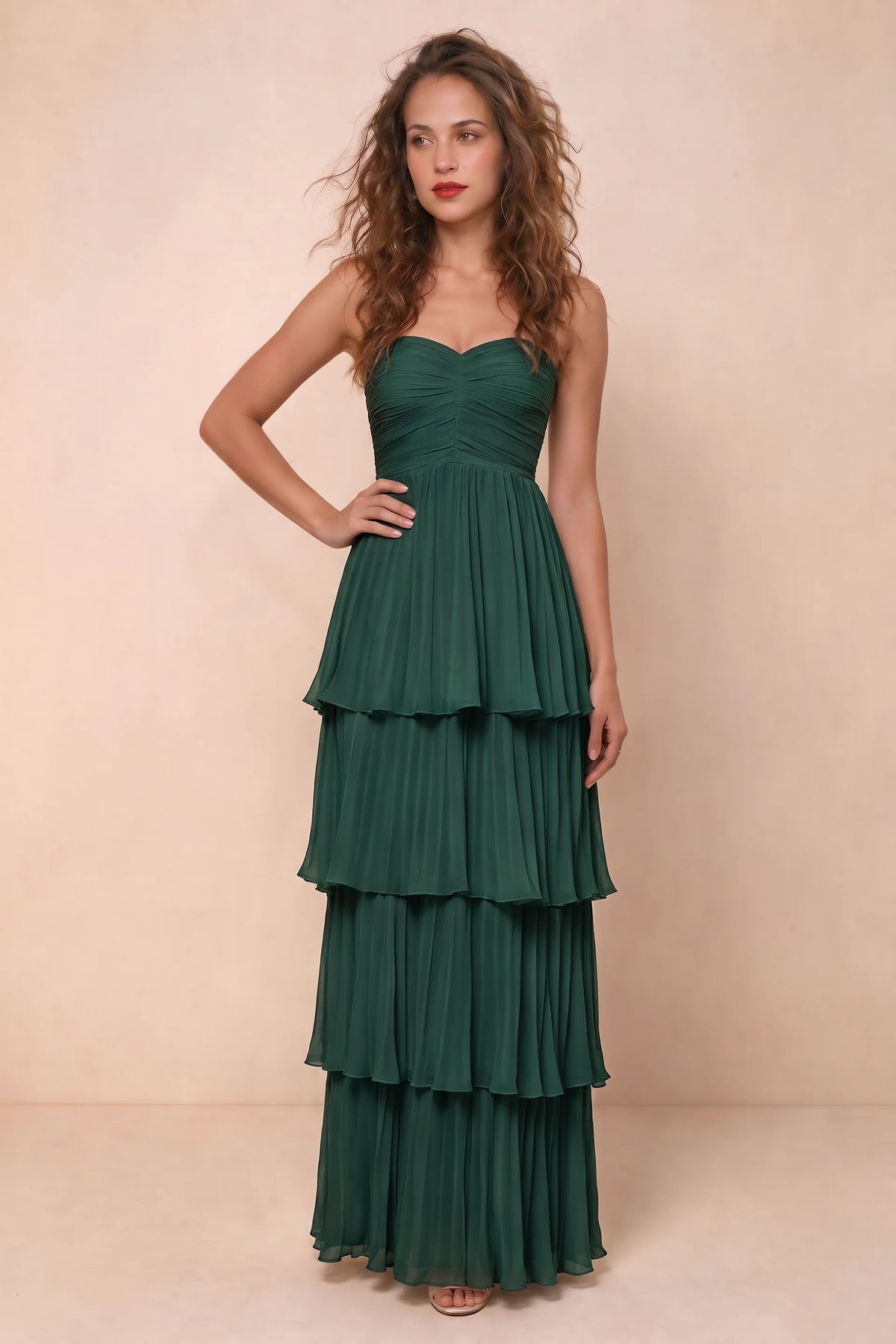 Alternate front studio view of Sonia hunter green tiered pleated maxi dress with a long flowing skirt