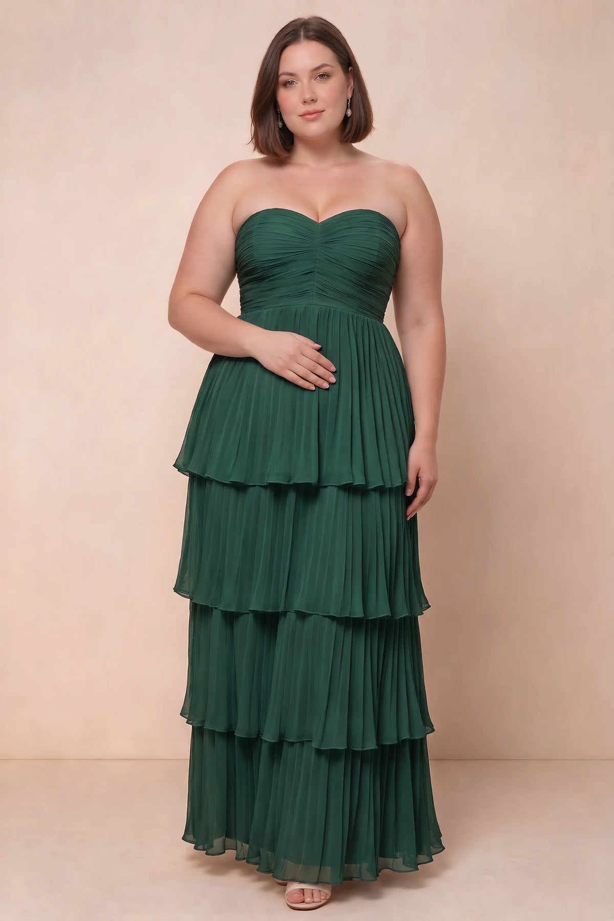 Front view on a second model of Sonia hunter green tiered pleated maxi dress with a long flowing skirt