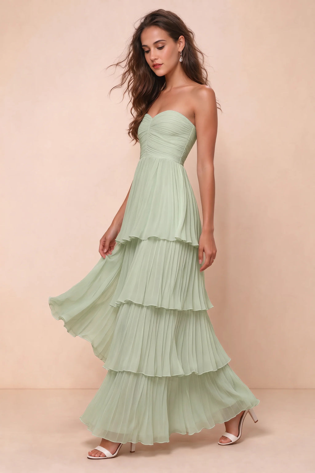 Front studio view of Sonia light green tiered pleated maxi dress with a long flowing skirt