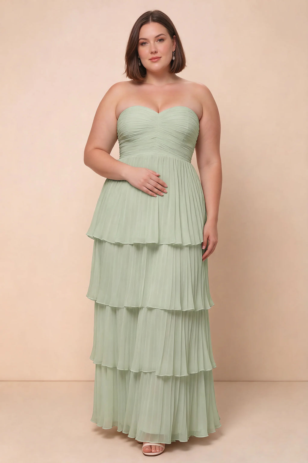 Front view on a second model of Sonia light green tiered pleated maxi dress with a long flowing skirt