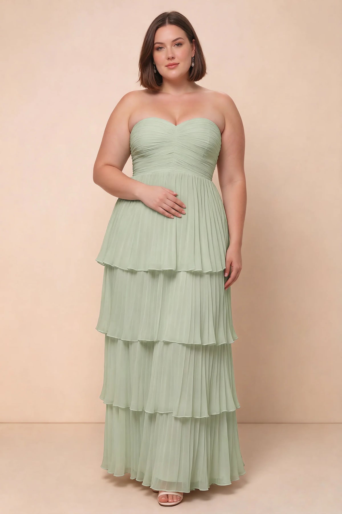 Front view on a second model of Sonia light green tiered pleated maxi dress with a long flowing skirt