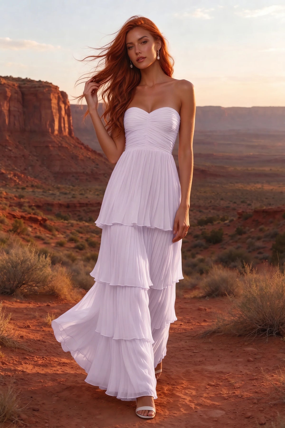 Outdoor front view in a desert canyon at sunset of Sonia lilac tiered pleated maxi dress with a long flowing skirt