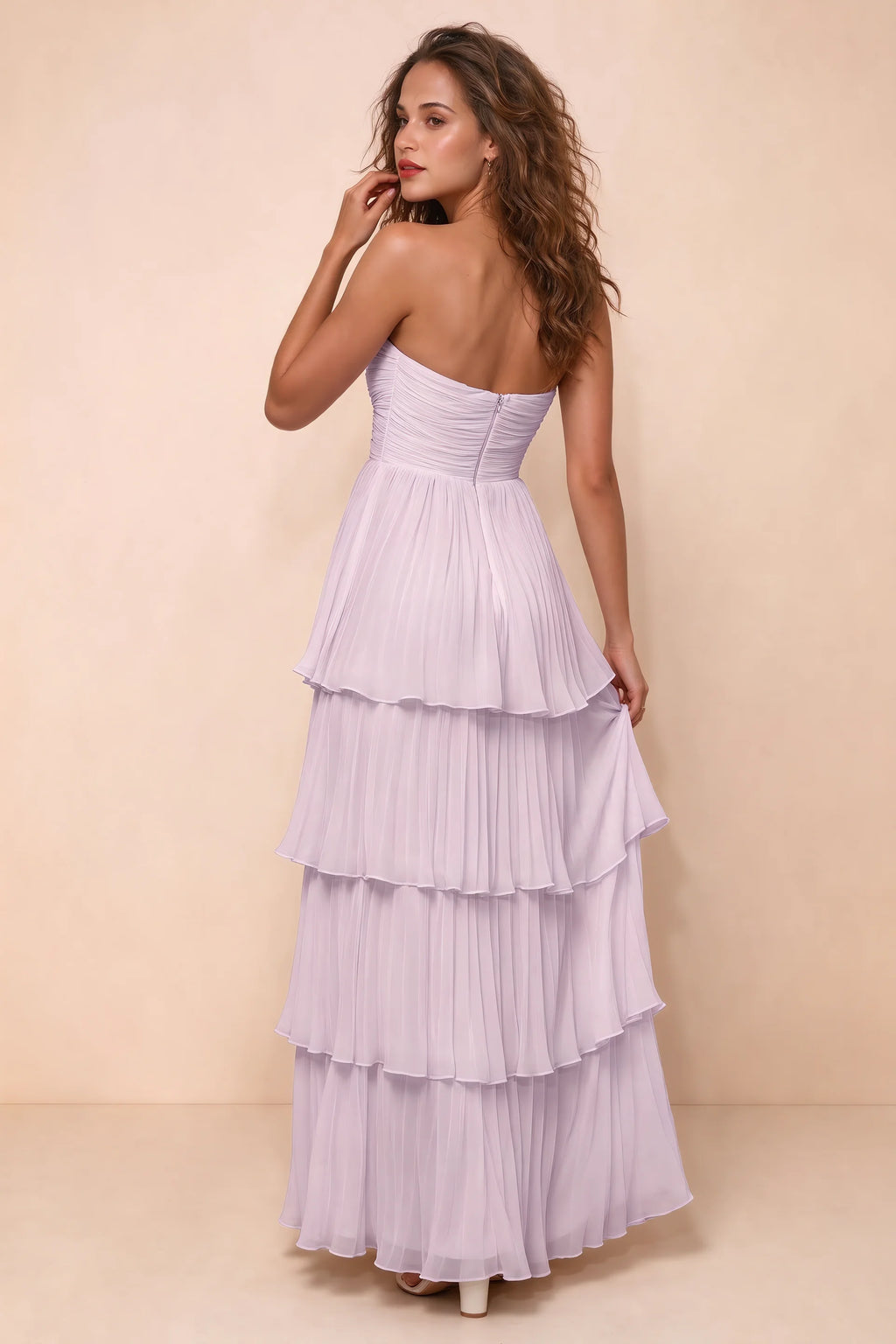 Rear studio view of Sonia lilac tiered pleated maxi dress with a long flowing skirt