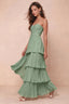 Front studio view of Sonia matcha green tiered pleated maxi dress with a long flowing skirt
