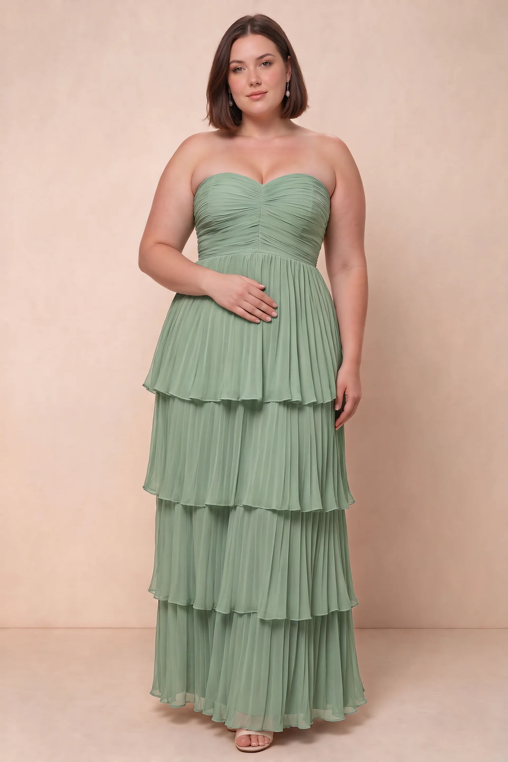 Front view on a second model of Sonia matcha green tiered pleated maxi dress with a long flowing skirt