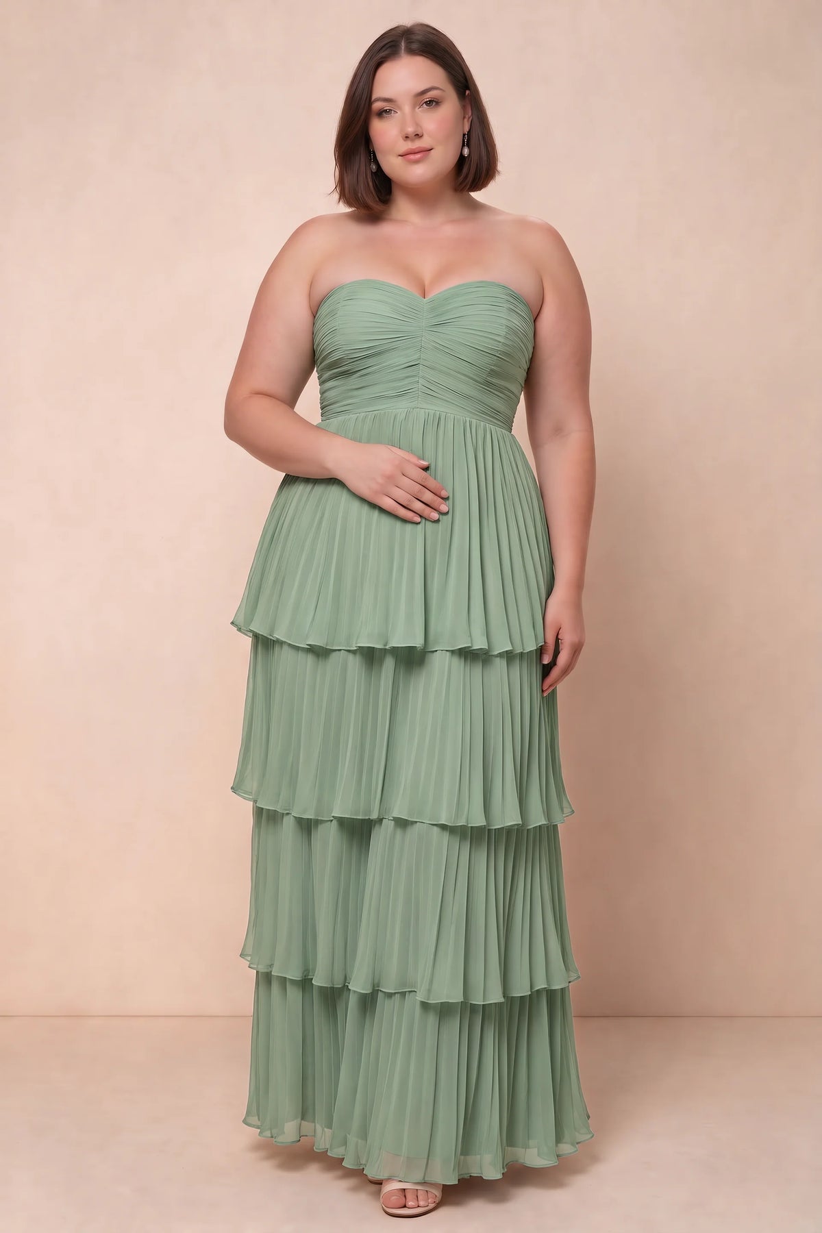 Front view on a second model of Sonia matcha green tiered pleated maxi dress with a long flowing skirt