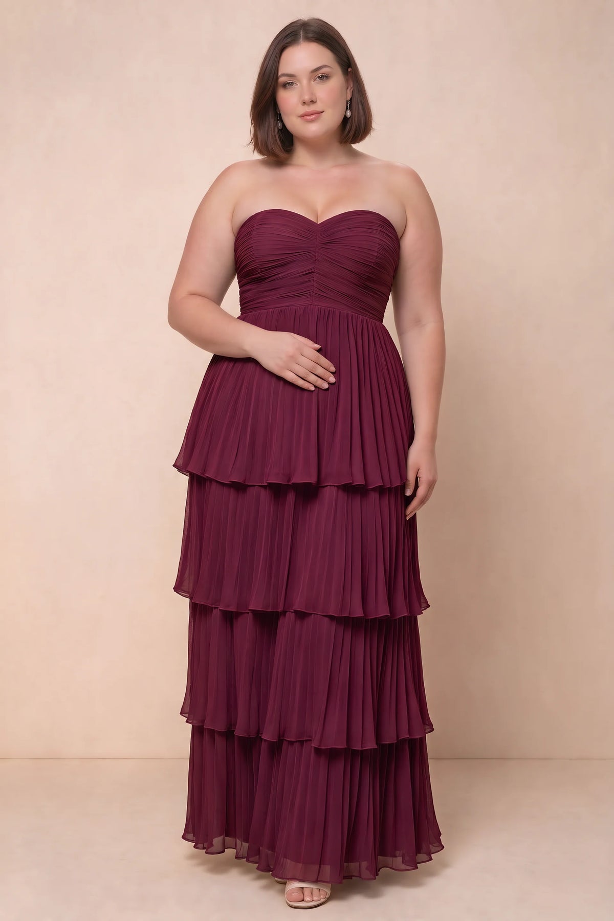 Front view on a second model of Sonia merlot tiered pleated maxi dress with a long flowing skirt