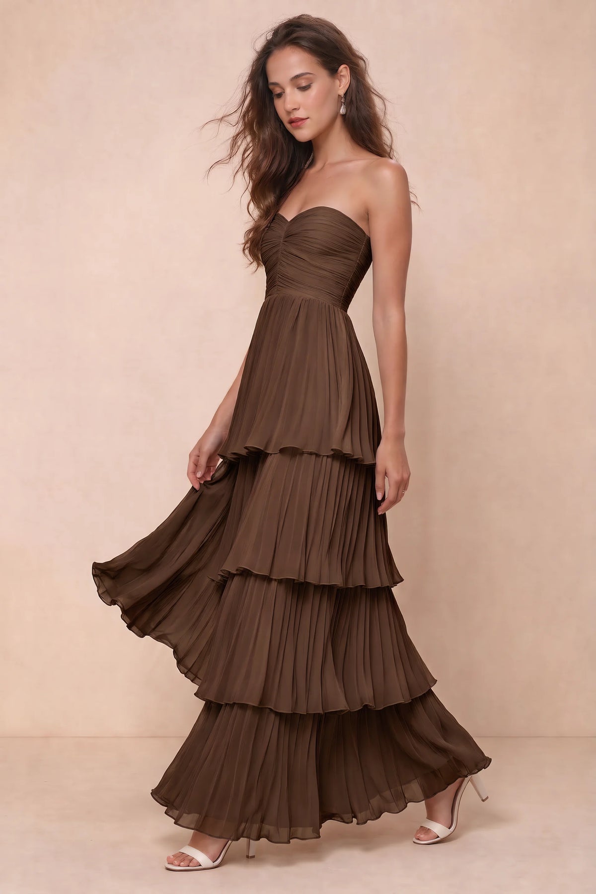 Front studio view of Sonia mocha tiered pleated maxi dress with a long flowing skirt