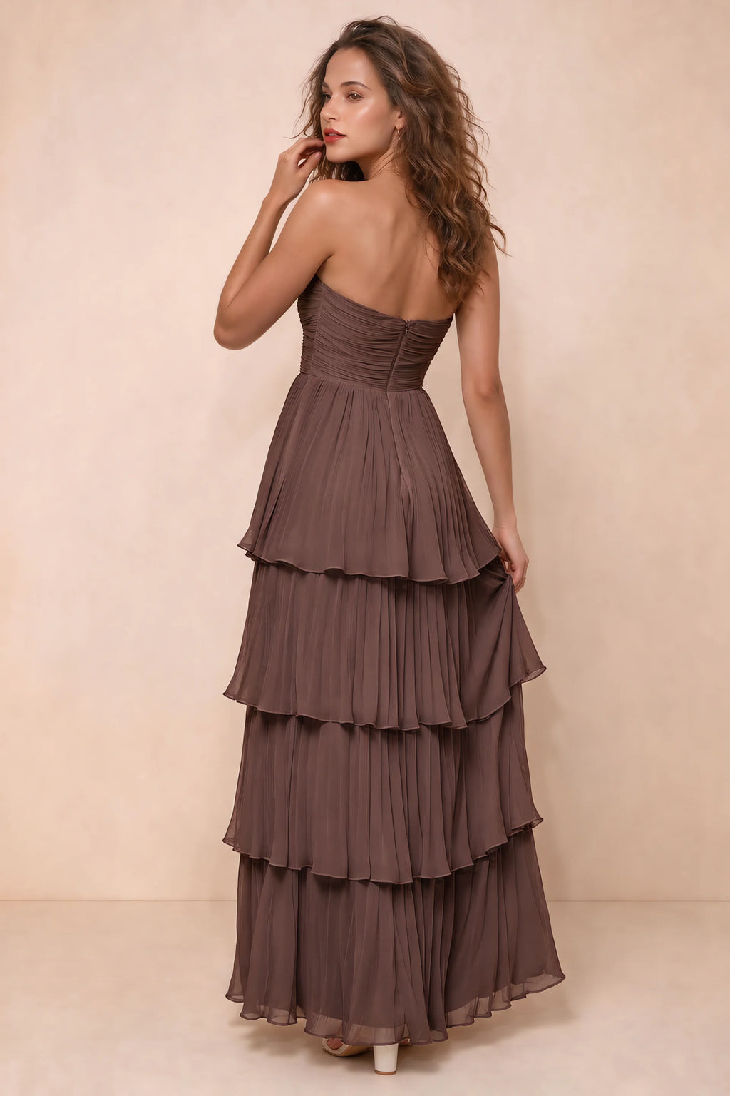 Rear studio view of Sonia mocha tiered pleated maxi dress with a long flowing skirt