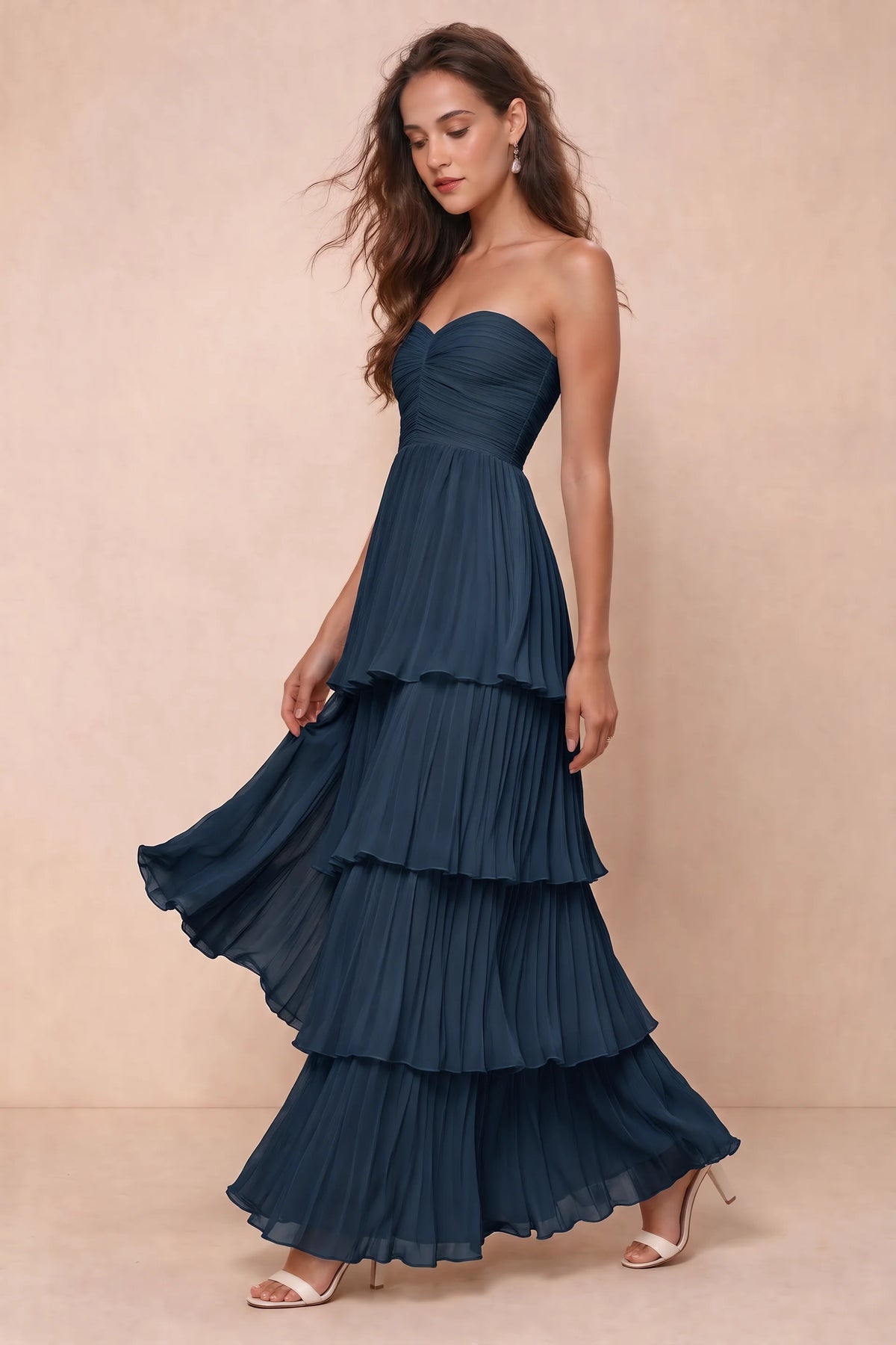Front studio view of Sonia navy tiered pleated maxi dress with a long flowing skirt