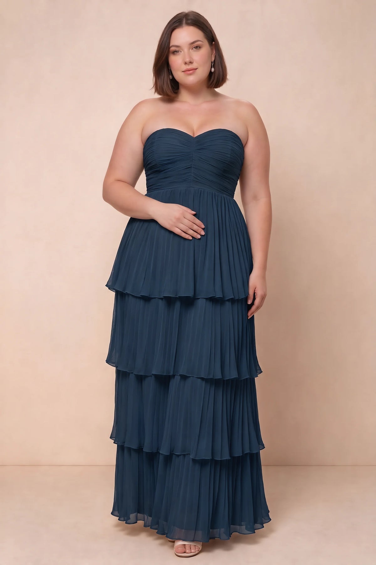 Front view on a second model of Sonia navy tiered pleated maxi dress with a long flowing skirt