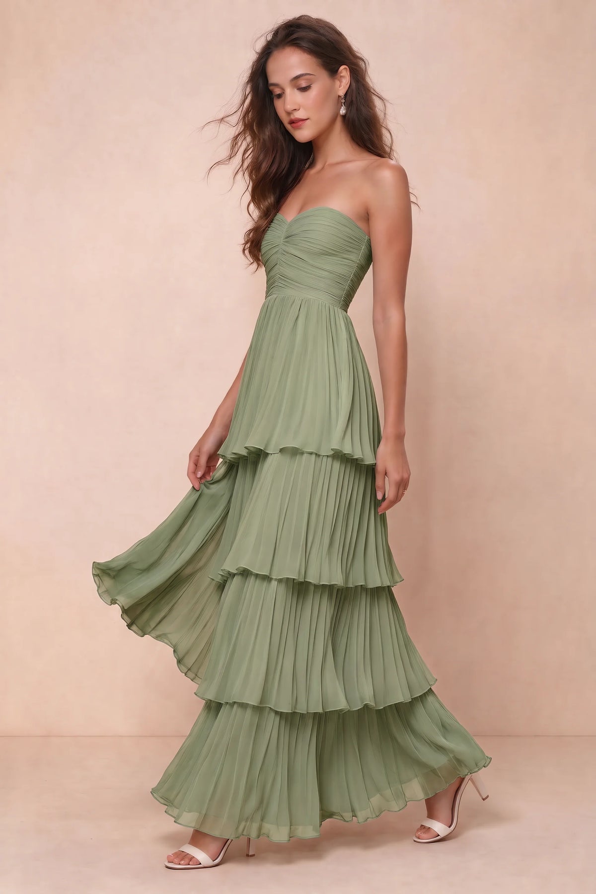 Front studio view of Sonia pistachio tiered pleated maxi dress with a long flowing skirt