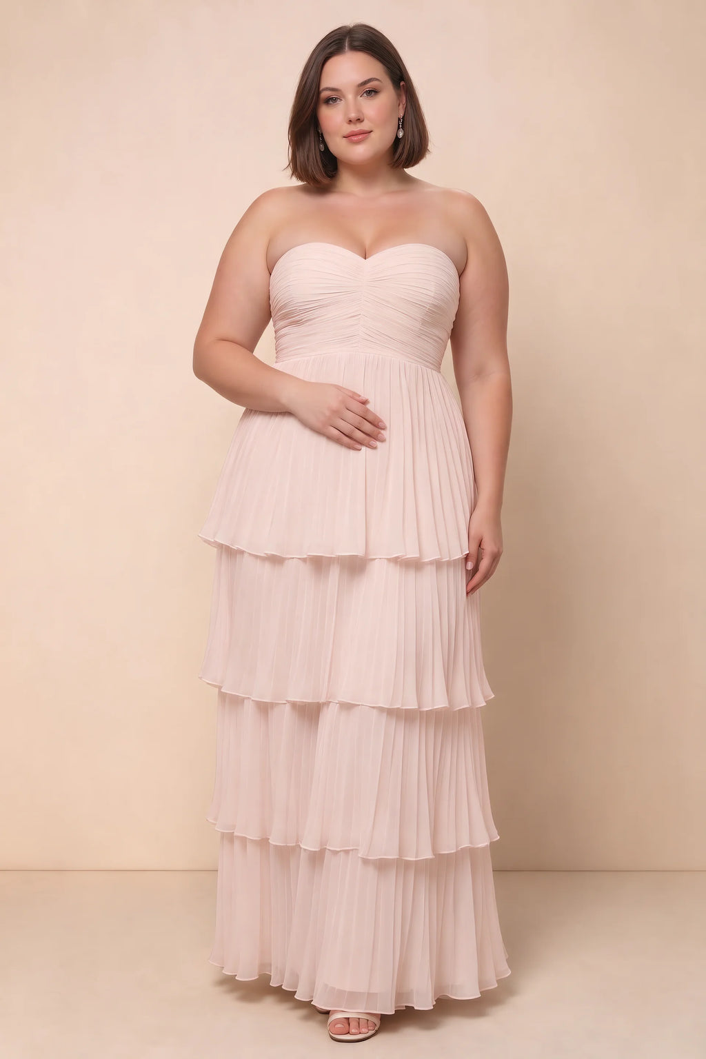 Front view on a second model of Sonia powder pink tiered pleated maxi dress with a long flowing skirt