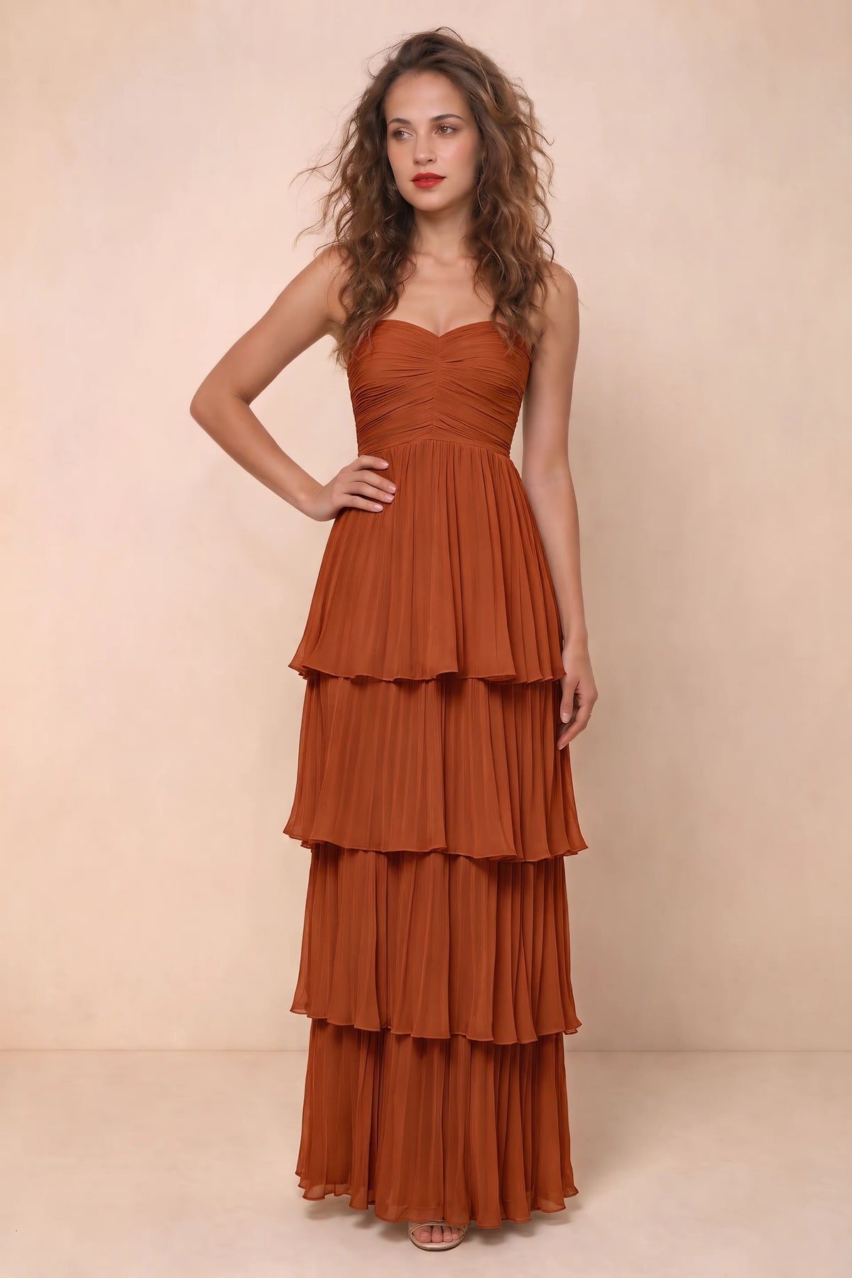 Alternate front studio view of Sonia rust tiered pleated maxi dress with a long flowing skirt