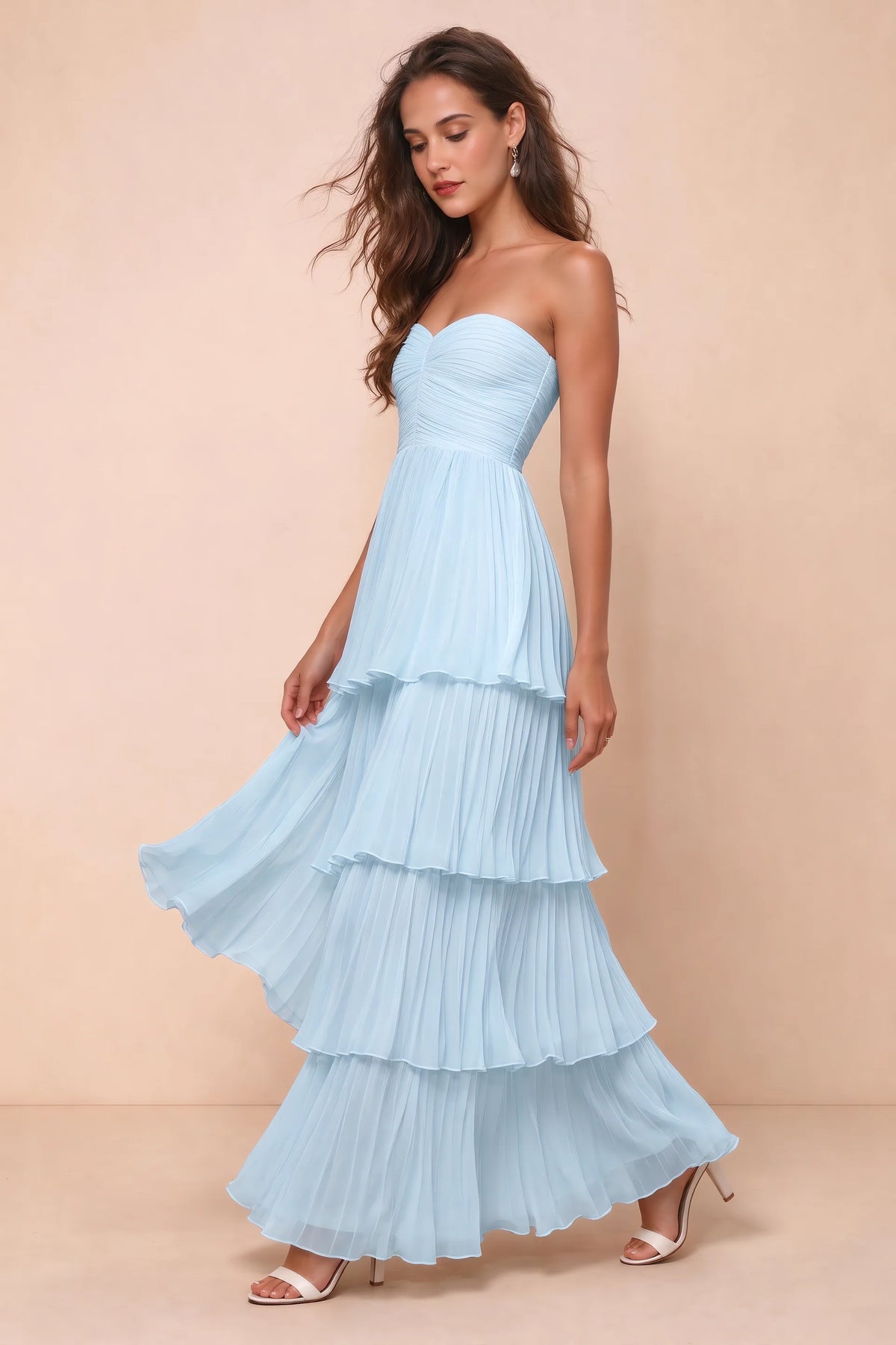 Front studio view of Sonia sky blue tiered pleated maxi dress with a long flowing skirt