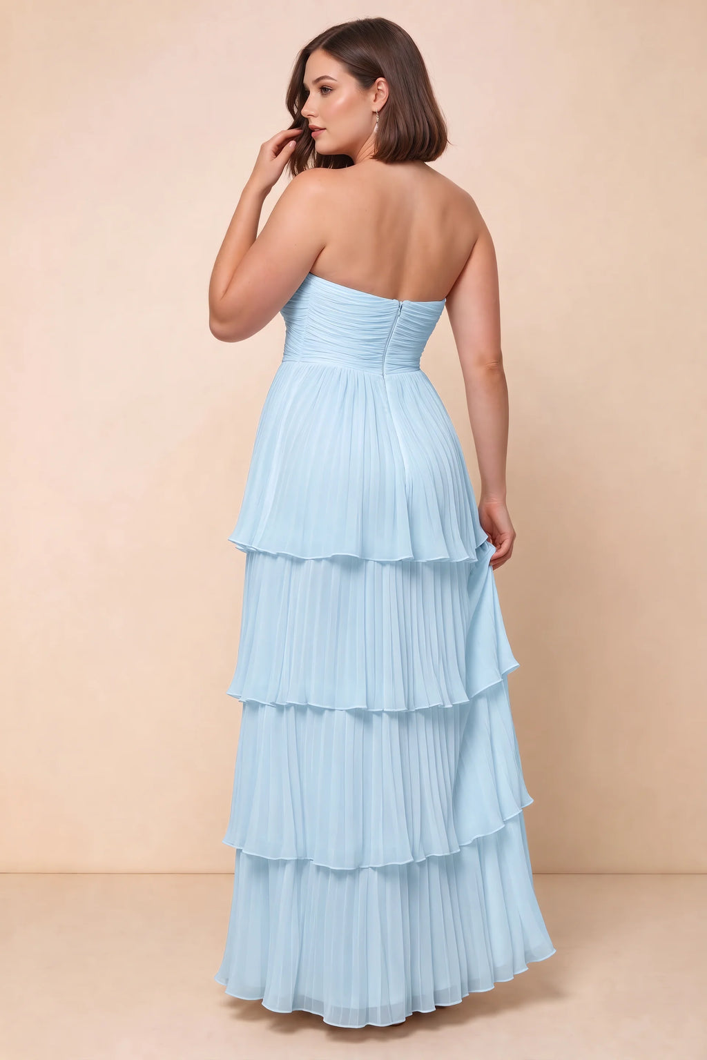 Rear view on a second model of Sonia sky blue tiered pleated maxi dress with a long flowing skirt