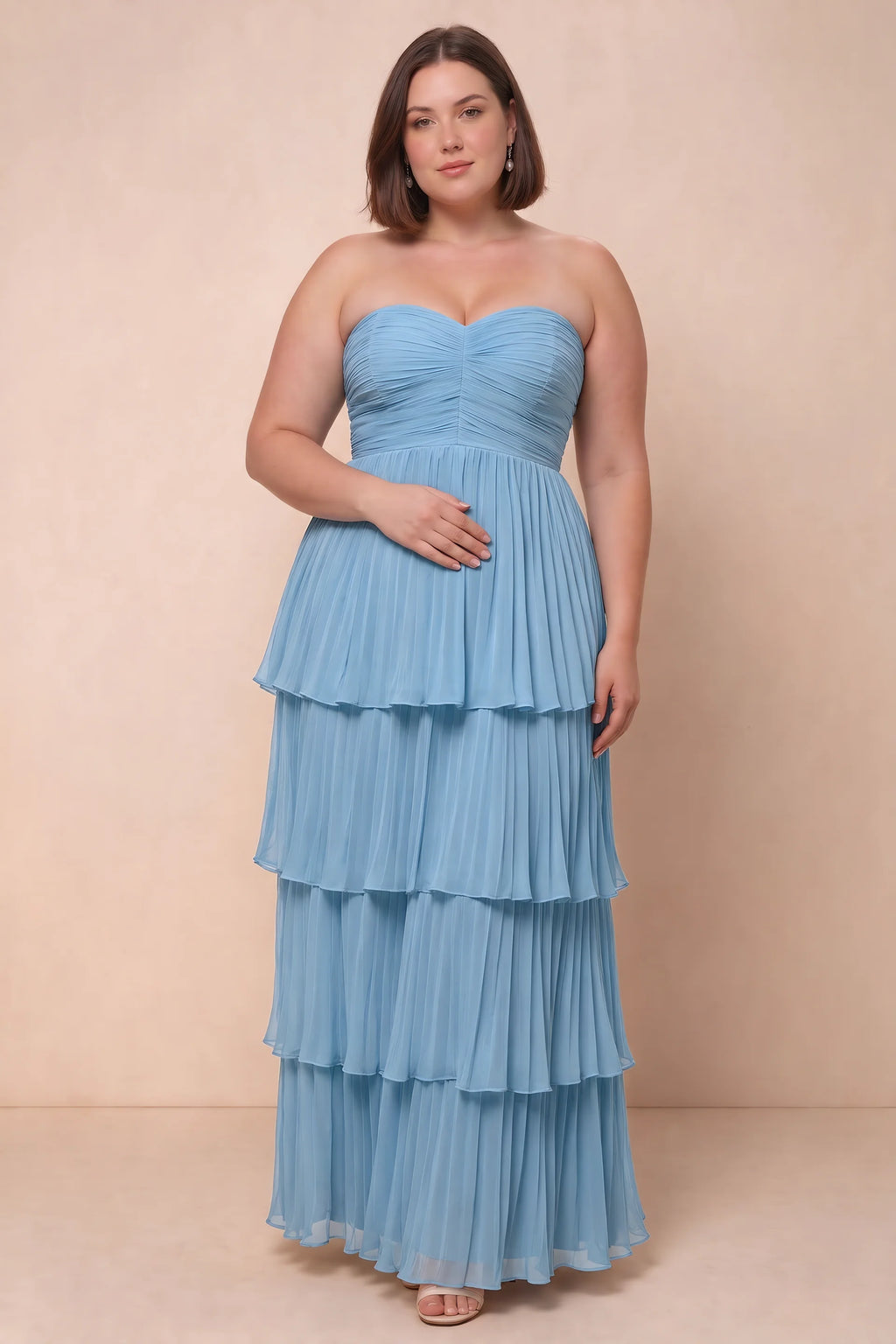 Front view on a second model of Sonia steel blue tiered pleated maxi dress with a long flowing skirt
