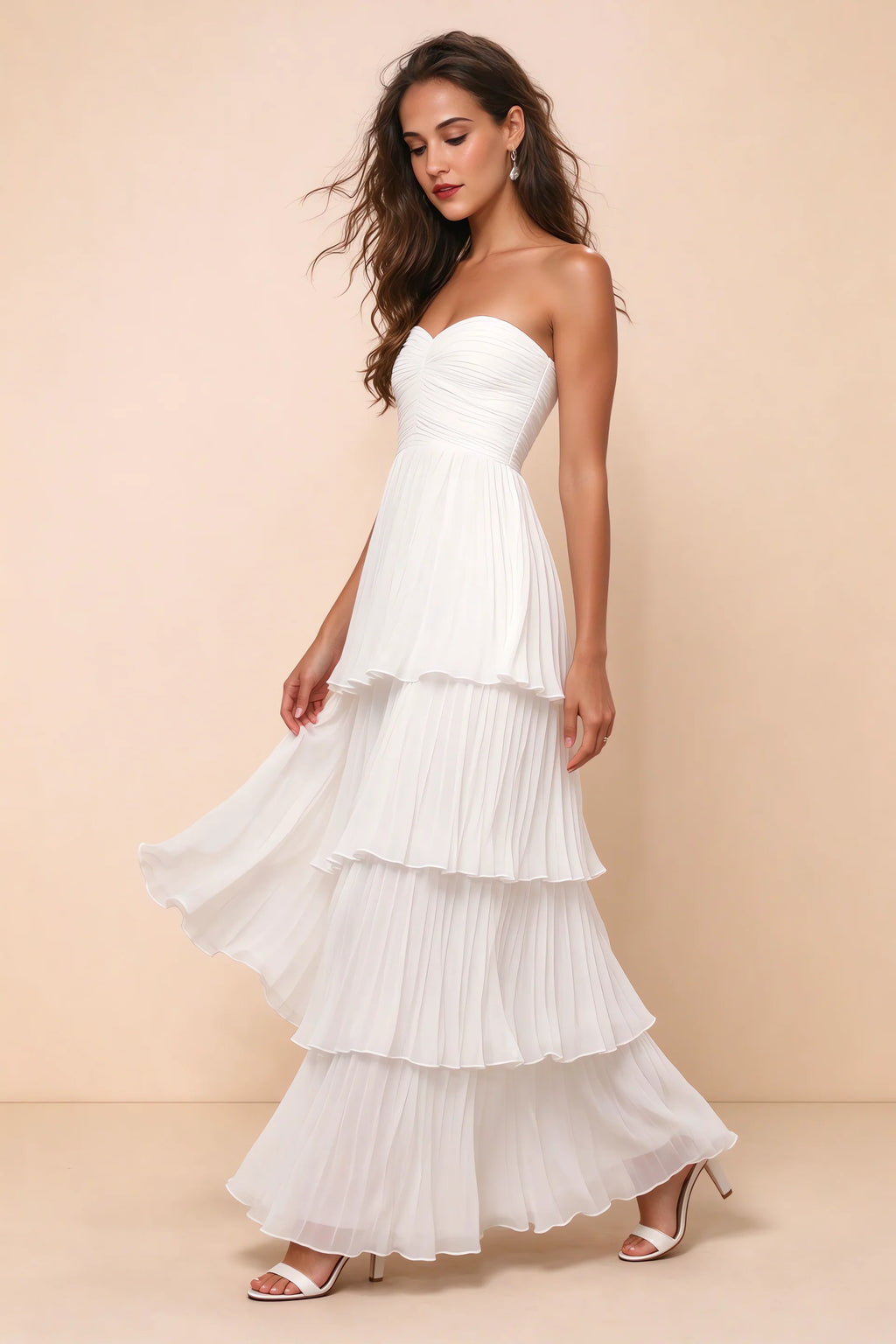 Front studio view of Sonia white tiered pleated maxi dress with a long flowing skirt