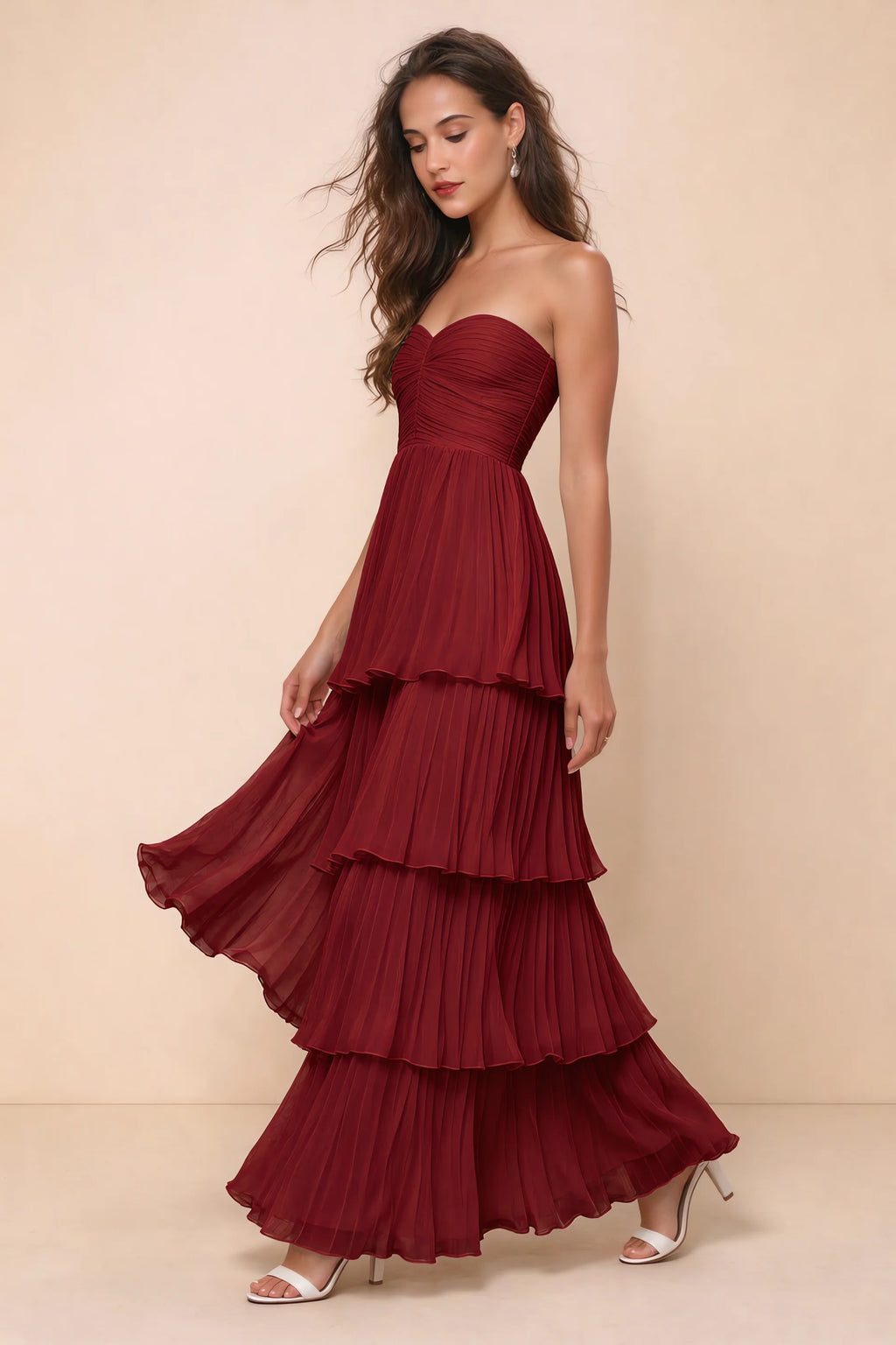 Front studio view of Sonia wine tiered pleated maxi dress with a long flowing skirt