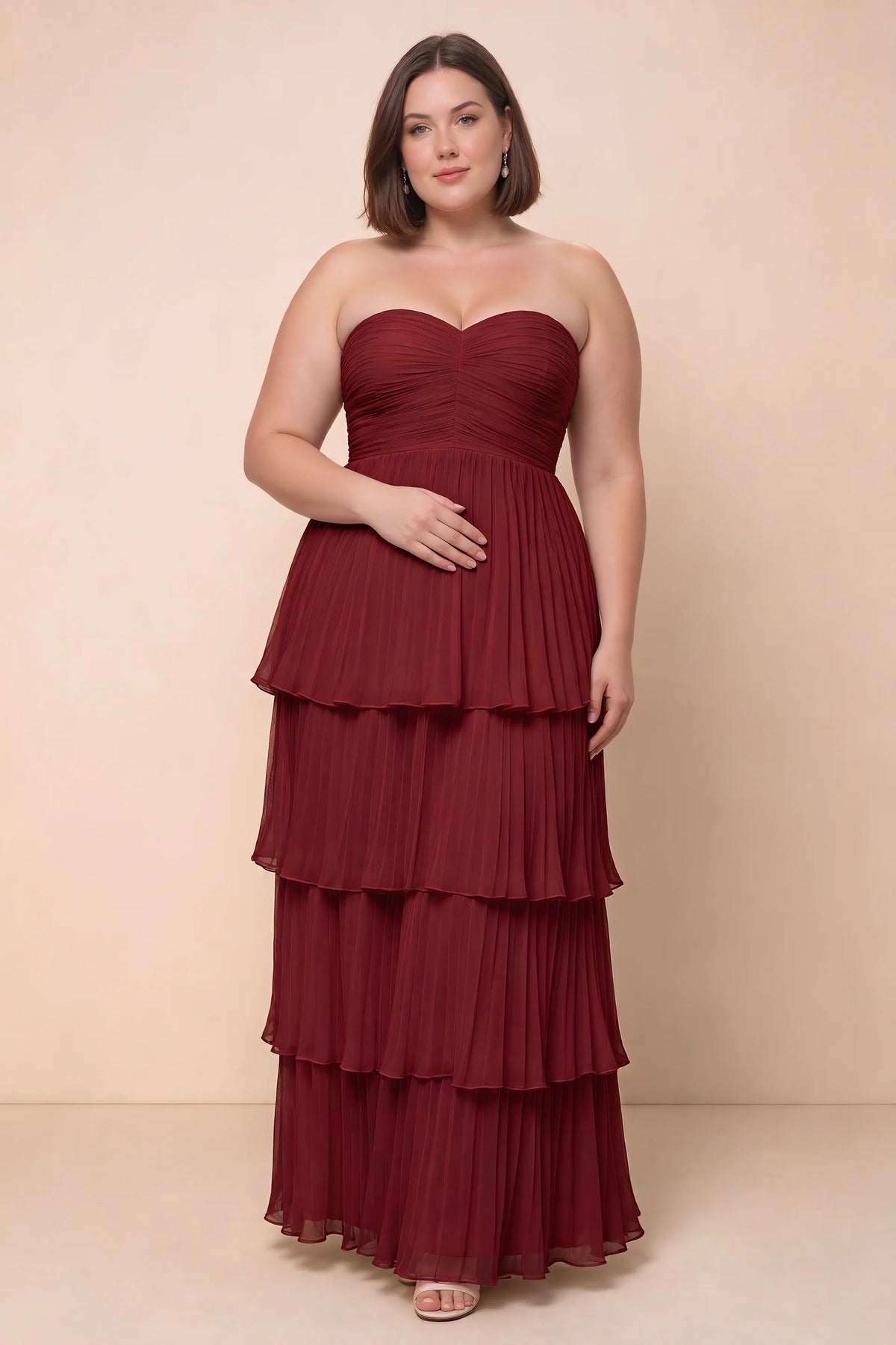 Front view on a second model of Sonia wine tiered pleated maxi dress with a long flowing skirt