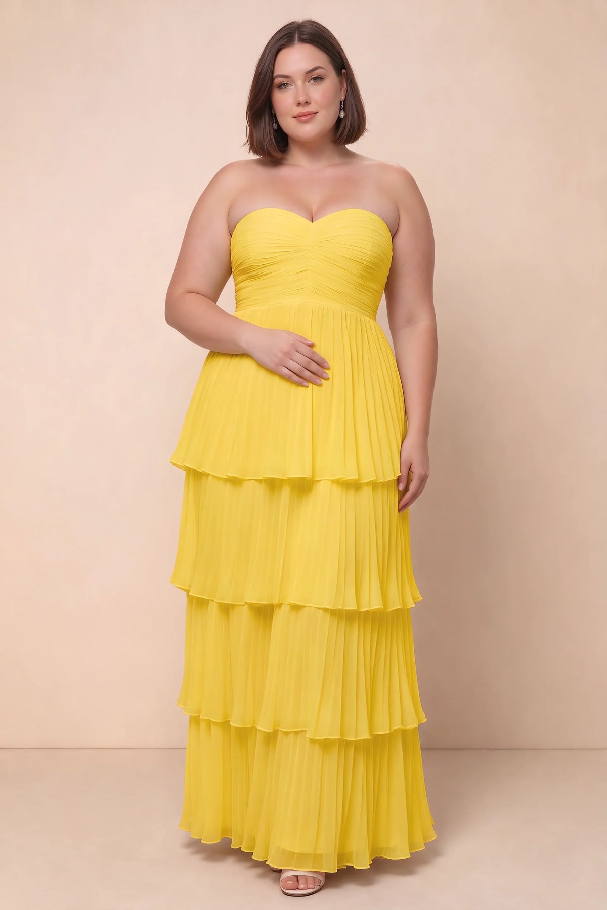 Front view on a second model of Sonia yellow tiered pleated maxi dress with a long flowing skirt