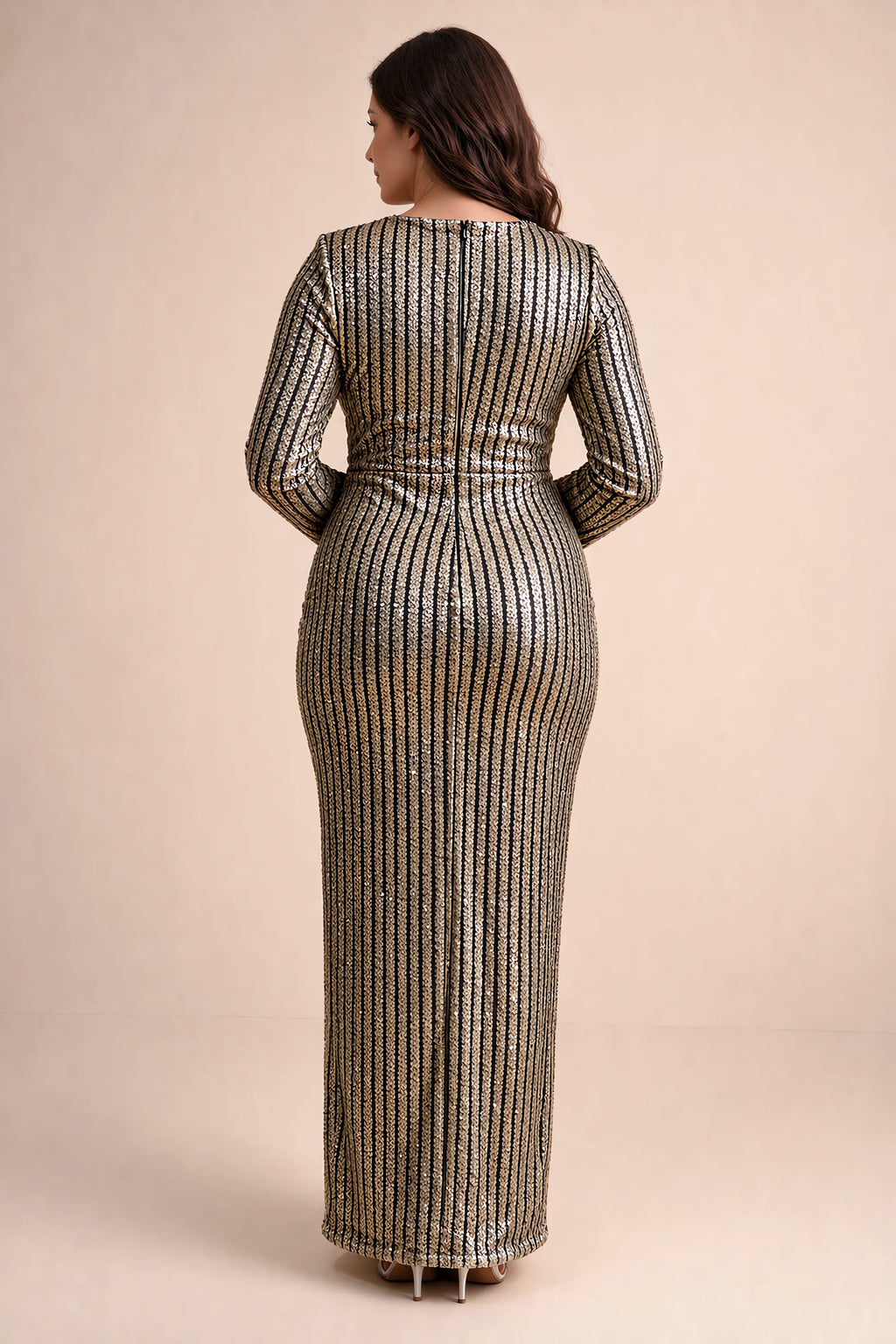 Rear view on a second model of Valeria gold long sleeve V-neck slit maxi dress with a long straight skirt