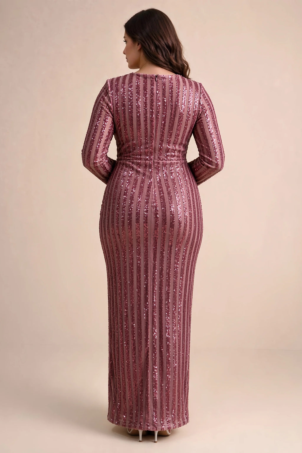 Rear view on a second model of Valeria rose gold long sleeve V-neck slit maxi dress with a long straight skirt