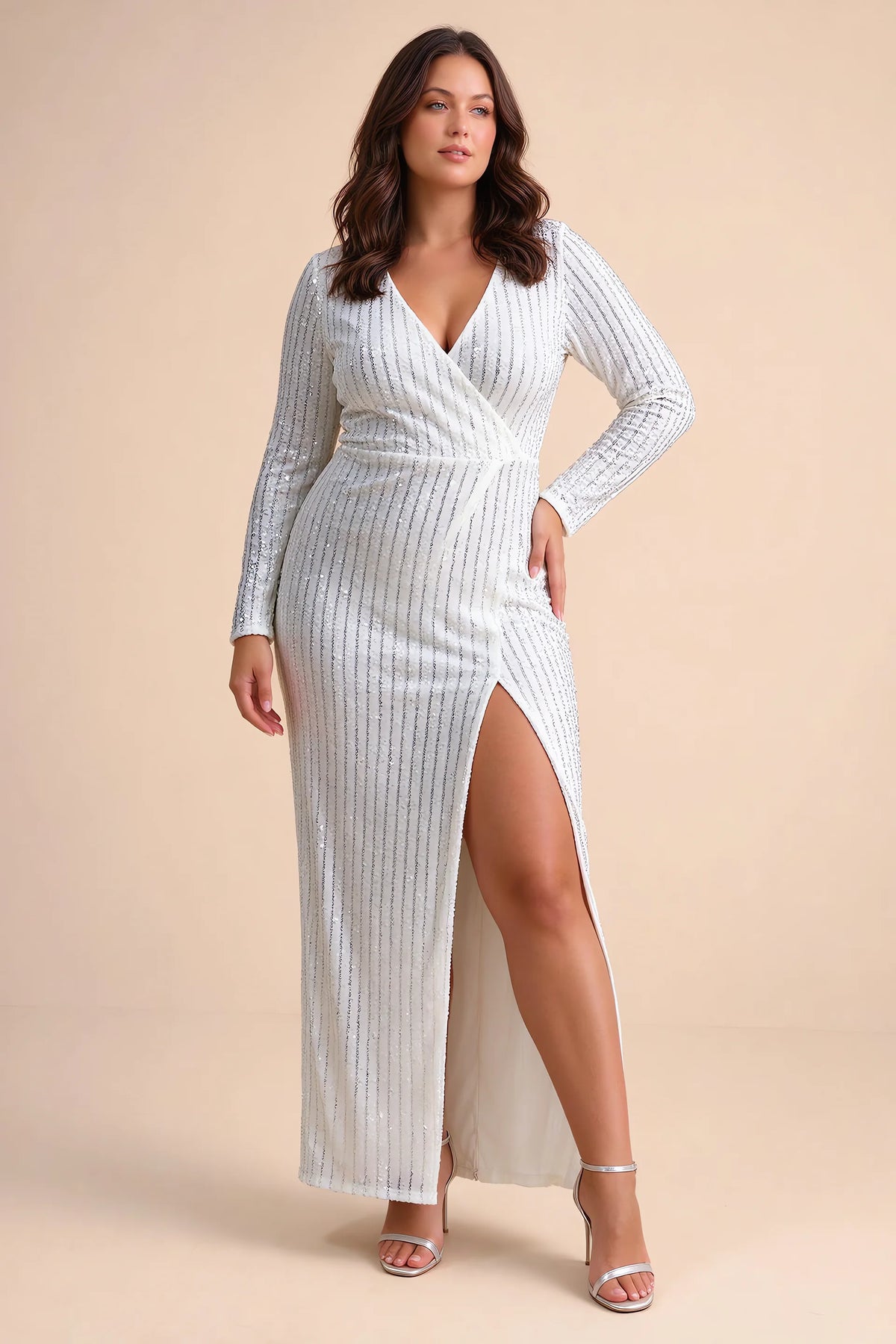 Front view on a second model of Valeria silver long sleeve V-neck slit maxi dress with a long straight skirt